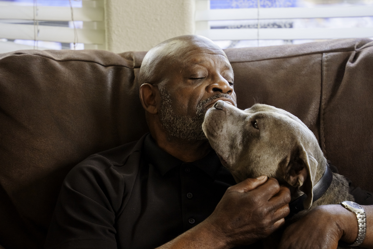 Veteran at home with his dog