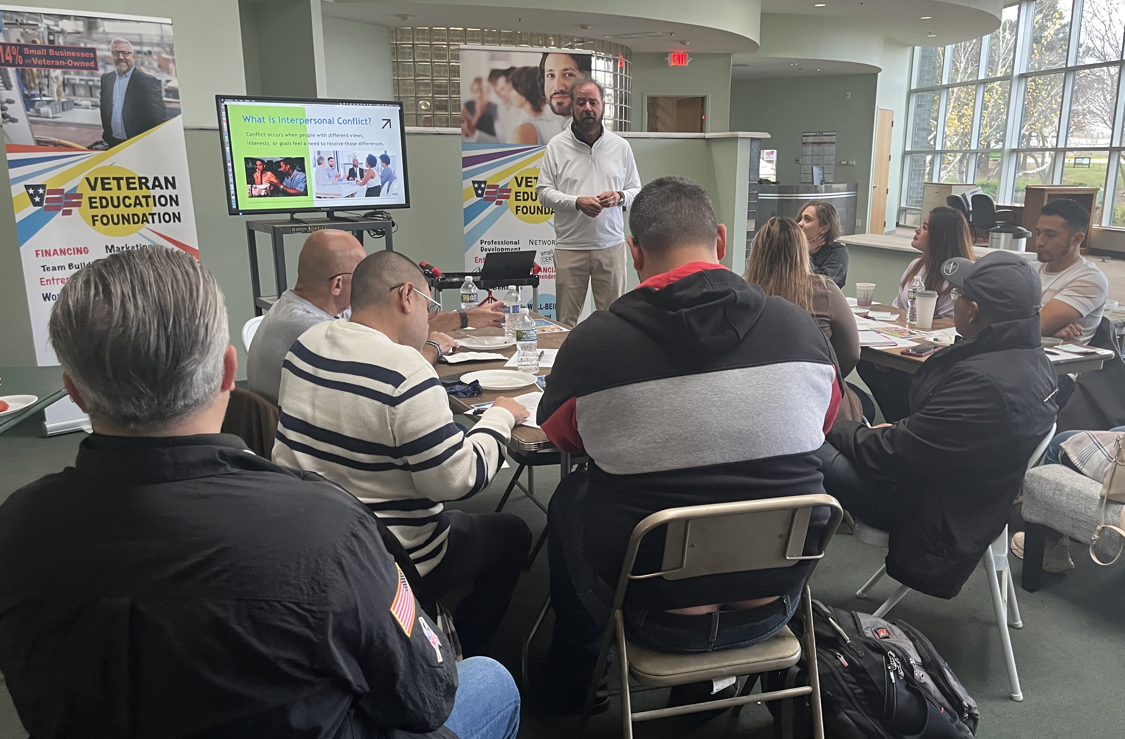 Triton College Communication Professor David Felix, PhD, JD, delivering a lecture on building interpersonal relationships to a roomful of USMC, Army and Air Force veterans.