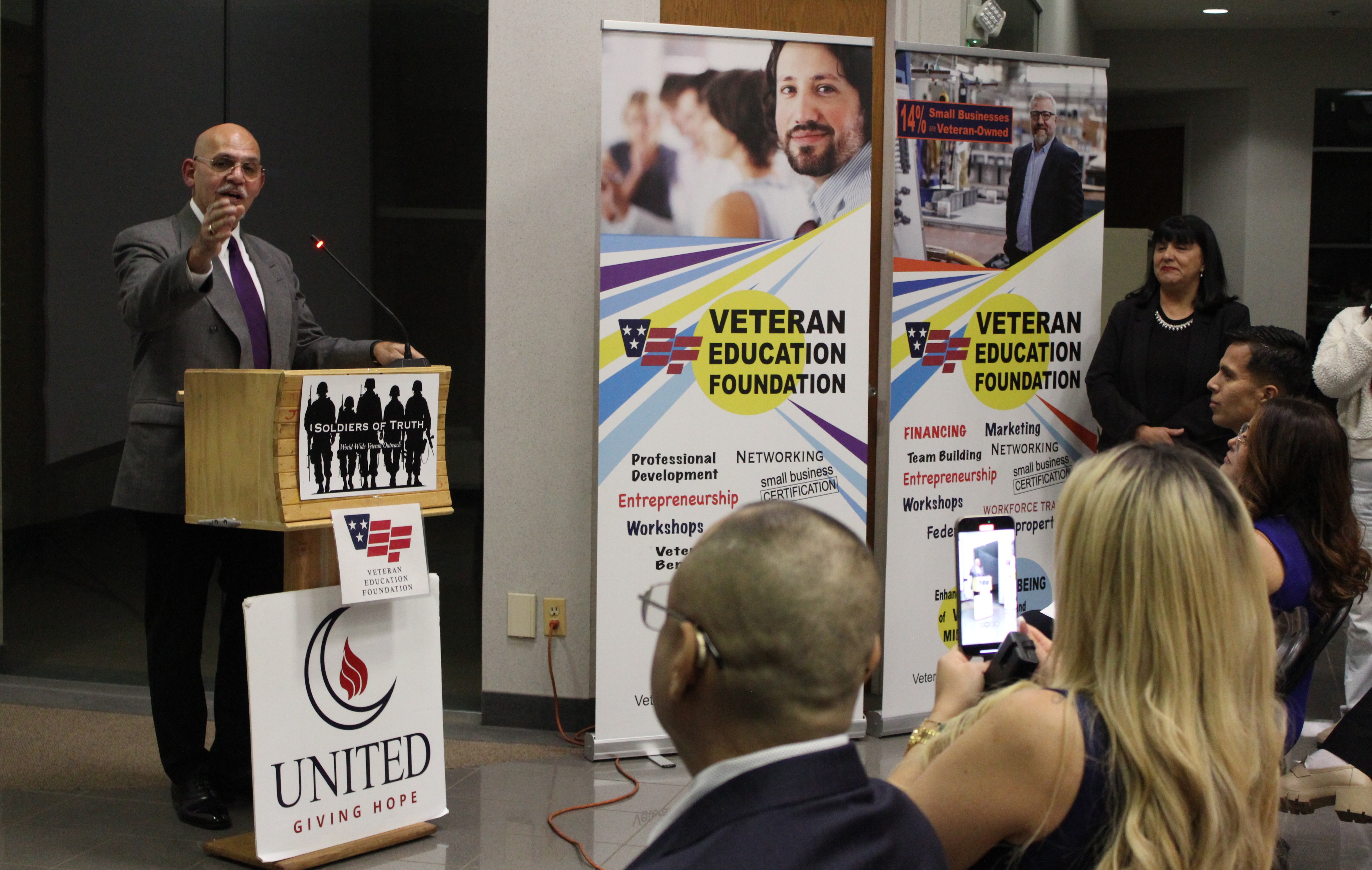 Hector Rodriguez addressing a packed room of veterans and military families, Waukegan, IL, Nov 2024
